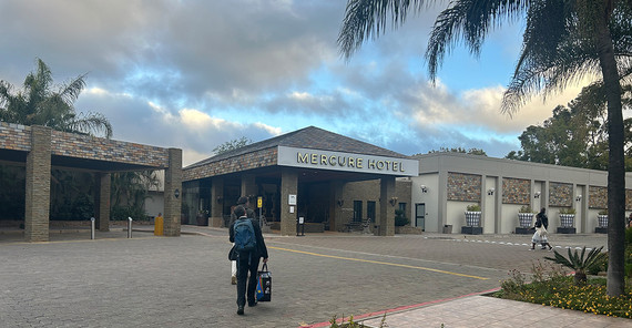 a person walking towards hotel building