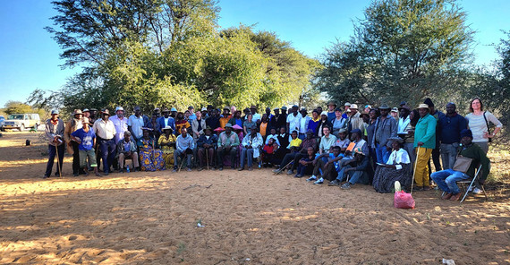 about 80 people posing for a group picture