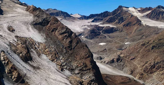 High Alpine Landscape with Roads along the Mountains.
