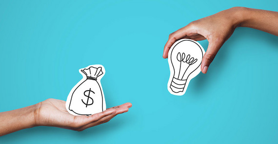 Two hands can be seen. The one on the left is holding a symbolic sack of money. The one on the right is holding a symbolic light bulb.