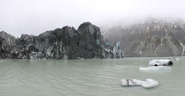 View of the Lituya Glacier: the ice front still protrudes some 40 to 50 meters out of the water.